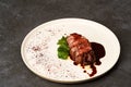 Filet mignon with mashed potatoes and pomegranate sauce, close-up Royalty Free Stock Photo