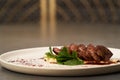 Filet mignon with mashed potatoes and pomegranate sauce, close-up Royalty Free Stock Photo