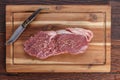 Filetsteak - Rumpsteak on a wooden plate Royalty Free Stock Photo