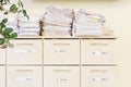 Filing cabinet and a stack of old papers Royalty Free Stock Photo