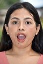 A Shouting Youthful Filipina Female