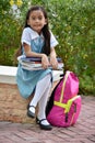 Smiling Cute Minority Girl Student With Books