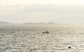 Filipino Banca boats being drenched by a midday rain