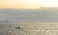 Filipino Banca boats being drenched by a midday rain