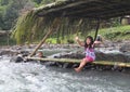 Joyful Filipino children on the banks of the river welcome tourists