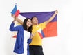 Filipino couple holding flag celebrating independence day