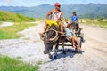 Filipino farmers riding a water cow cart along the volcanic field near Mount Pinatubo on Aug 27, 2017 in Capas, Central Luzon, Ph