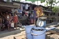 Filipino Fishmonger selling fish in slum Packwood