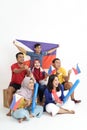 Filipino group of people holding philippines flag celebrating