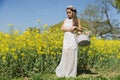 Filipino model in a rapeseed field in the springtime