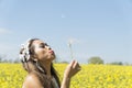 Filipino model in a rapeseed field in the springtime