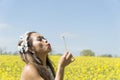 Filipino model in a rapeseed field in the springtime Royalty Free Stock Photo