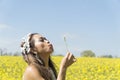 Filipino model in a rapeseed field in the springtime Royalty Free Stock Photo