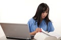 Filipino nurse doctor working on laptop Royalty Free Stock Photo