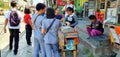 Filipino Office Workers Buy Ice Cream from Road Vendor During Work Breaktime