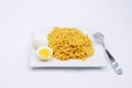 A Filipino Pancit Canton with boiled egg on a plate.