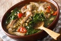 Filipino soup of beans mung with pork closeup in a bowl. horizon