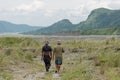 Filipinos walking in Pinatubo mountains Royalty Free Stock Photo