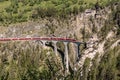 View of the historic Landwasser Viaduct with a train