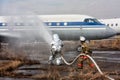 Fill the plane with fire-fighting foam after emergency landing Royalty Free Stock Photo