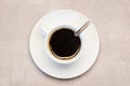 A filled cup with freshly brewed coffee and spoon on countertop Royalty Free Stock Photo