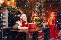 Filled with happiness cheer and love. Girl enjoy cozy warm atmosphere christmas eve. Christmas joy. Woman wooden