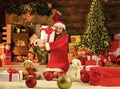 filled with joyful noise. happy girl santa. santa woman feel happiness in new year. girl santa among xmas presents box Royalty Free Stock Photo