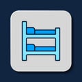 Filled outline Bunk bed icon isolated on blue background. Vector