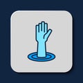 Filled outline Helping hand icon isolated on blue background. Vector