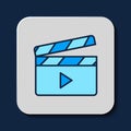 Filled outline Movie clapper icon isolated on blue background. Film clapper board. Clapperboard sign. Cinema production