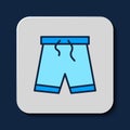 Filled outline Swimming trunks icon isolated on blue background. Vector