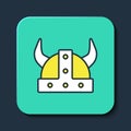 Filled outline Viking in horned helmet icon isolated on blue background. Turquoise square button. Vector