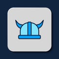 Filled outline Viking in horned helmet icon isolated on blue background. Vector