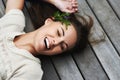 Filled with positive natural energy. An attractive young woman lying on her porch.