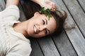 Filled with positive natural energy. An attractive young woman lying on her porch.