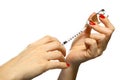 Filled syringe in a woman hands