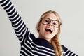 Filled with youthful optimism. Portrait of a cute girl looking happy with her arms outstretched. Royalty Free Stock Photo