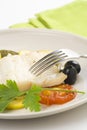 Fillet of cod baked tomatoes zucchini black olives Royalty Free Stock Photo