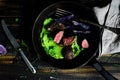 Fillet of lamb. mashed peas. baked purple potato