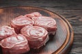 Fillet medallion on a cutting board. Raw meat. Pork fillet