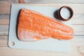 Fillet of salmon fish on white paper closeup