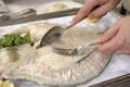 Filleting a poached turbot