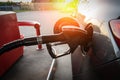 Filling car petrol. Pump gas fuel at gasoline oil station for nozzle tank. Black handle of the refueling gun Royalty Free Stock Photo