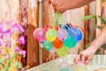 Filling colorful water balloons Royalty Free Stock Photo