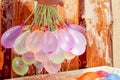 Filling colorful water balloons Royalty Free Stock Photo