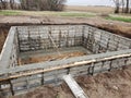 New Construction. Pouring the concrete walls of a basement.