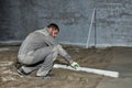 Filling the floor with concrete, screed and leveling the floor by construction workers. Smooth floors made of a mixture of cement Royalty Free Stock Photo