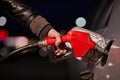 Fuel station nozzle filling car tank Royalty Free Stock Photo