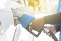 Filling gas at the station. Refill oil, gasoline, diesel vehicle.Hand refilling the car with fuel Royalty Free Stock Photo