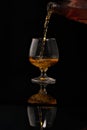 Filling a glass of brandy Royalty Free Stock Photo